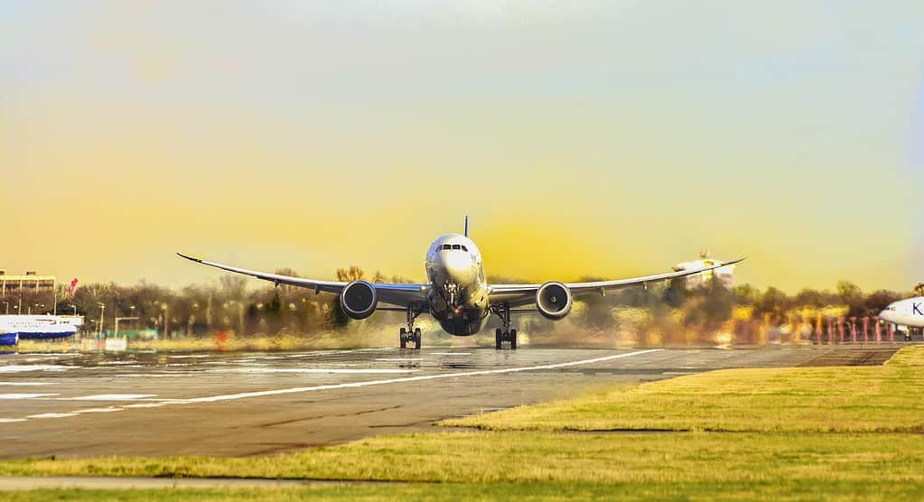 a photo of a plane taking off a runway